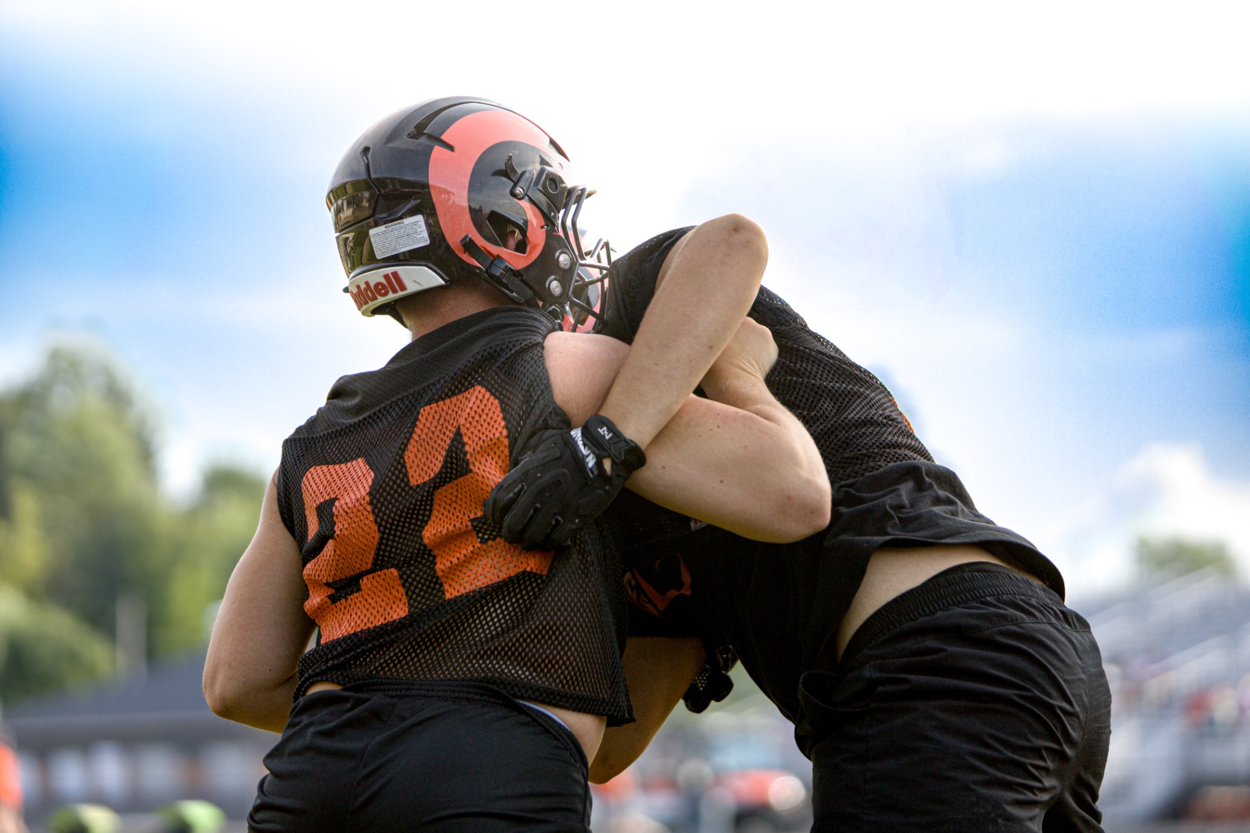 High school football linemen in the trenches — varsity action shot by Striide